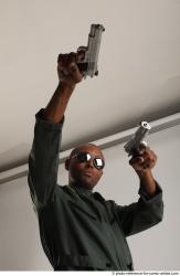 ERIC STANDING POSE WITH GUNS